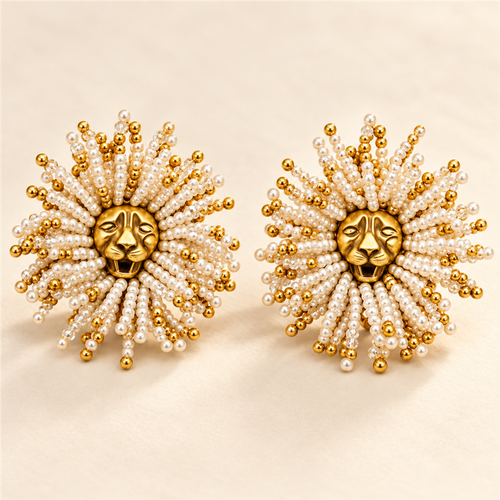 Golden Lion sunburst statement earrings on ivory background